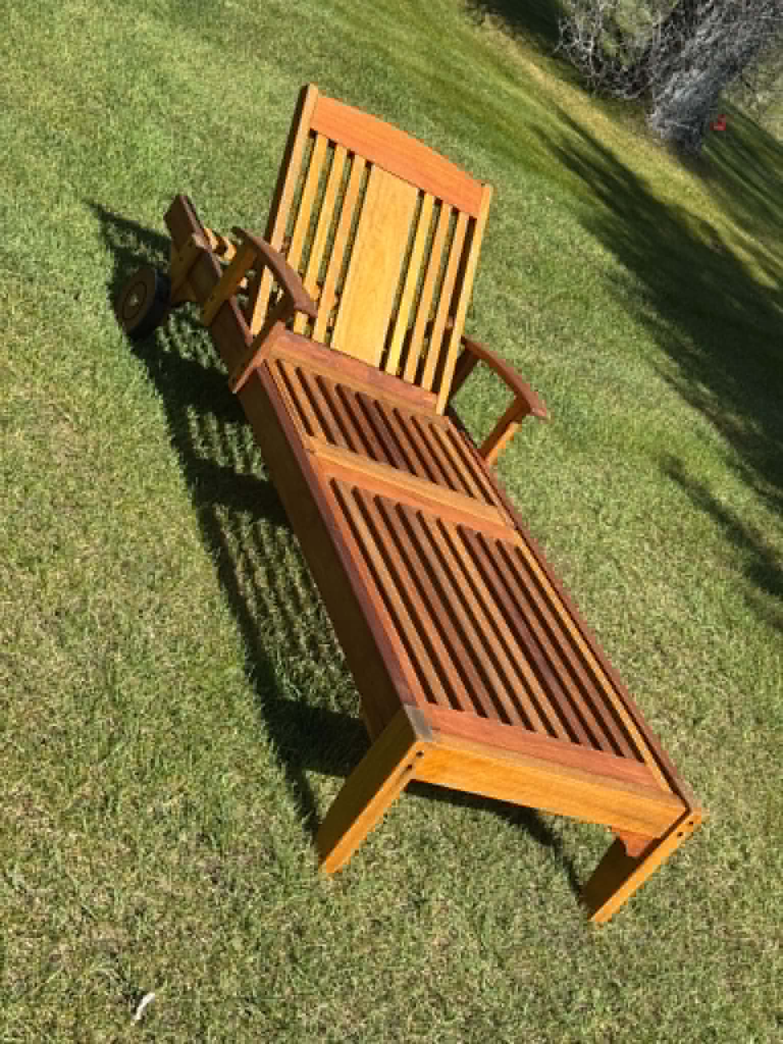 Fully refinished teak chaise lounger — rich warm tone